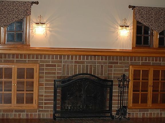 large living room with gumwood trim and crown molding
