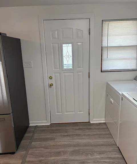 Back door entrance into drop zone/mudroom and laundry room