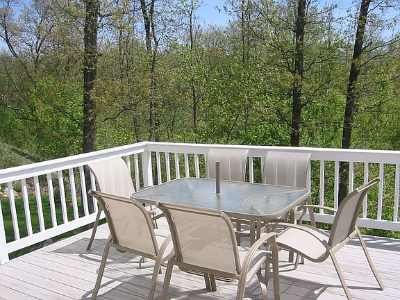 Deck off of eat-in kitchen with private views