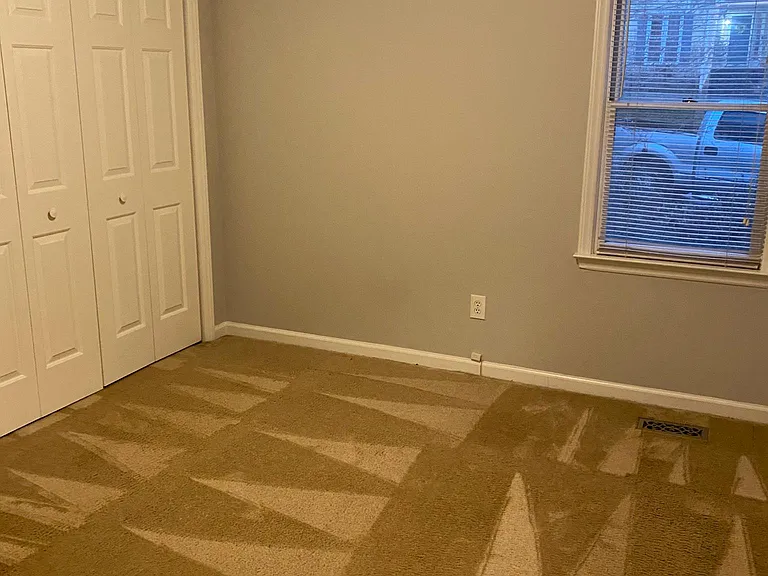 Bedroom 1 with large closet, now with updated LVP flooring.