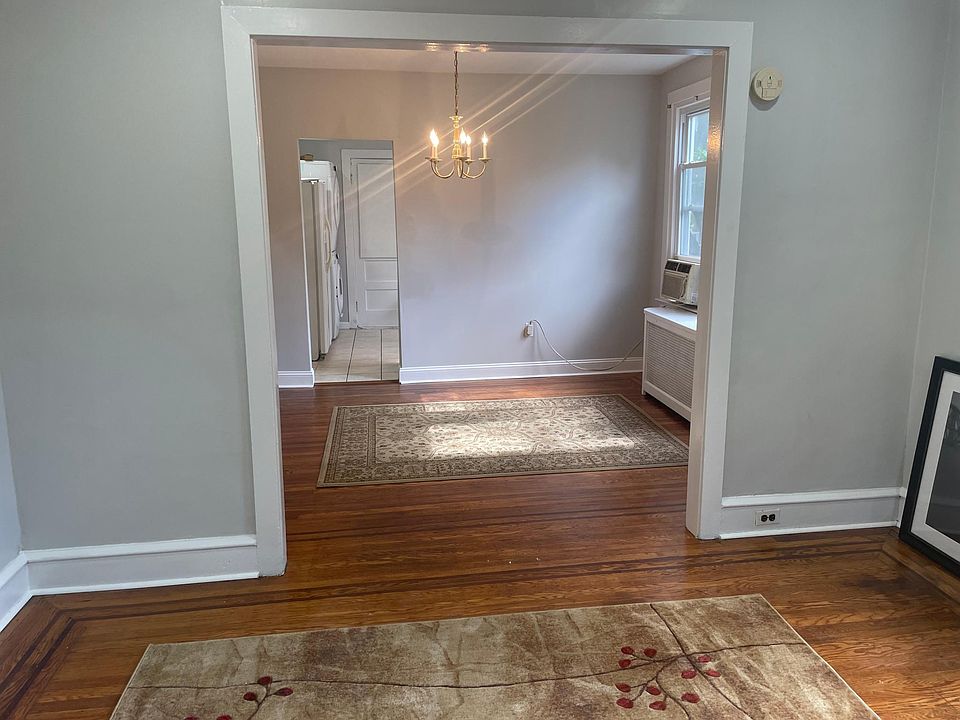 Freshly painted throughout apartment with all newly finished wood floors. This is the den as you enter front door looking into the dining room area.