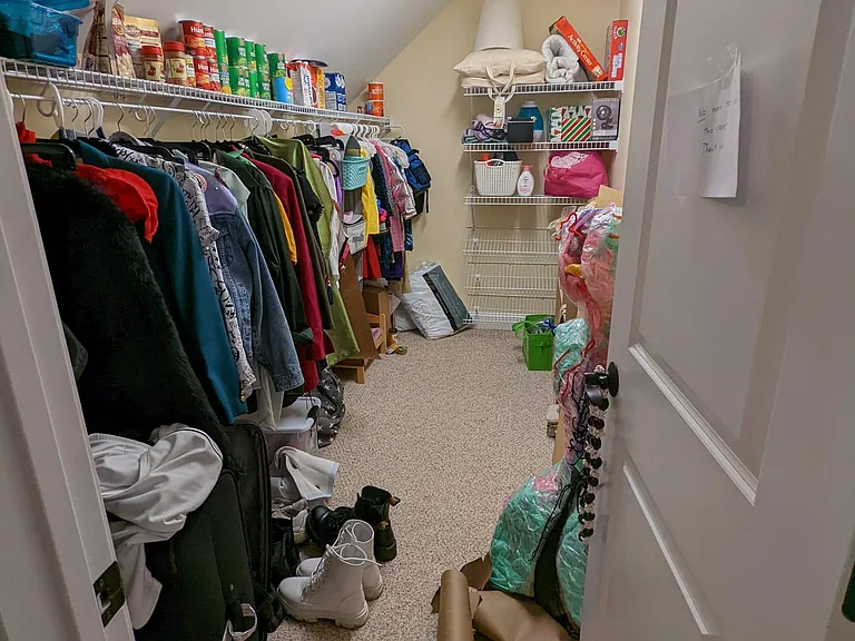 Walk-in closets for upstairs bedroom #2.