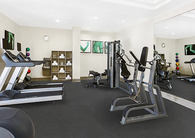 24/7 fitness center with cardio equipment, personal TVs and weight training