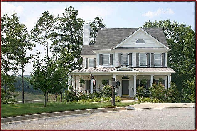 Beautiful home with inviting wrap around porch situated on a golf course-cul-de-sac lot