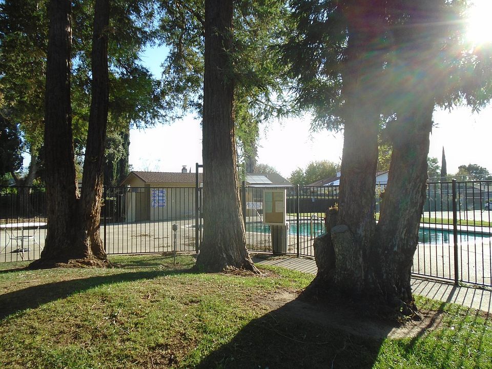 Use the pool and tennis court, and enjoy the beautiful, gated park-like setting right outside your back gate (without the hassle or expense of maintenance.