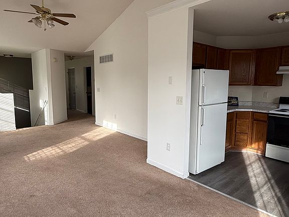 View of main floor. Kitchen on the right, dining room/living room