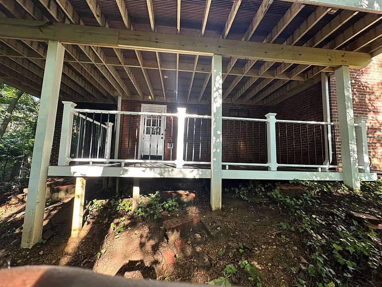 Lower deck with private entrance to basement.