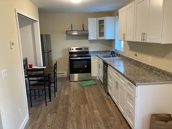 Kitchen w washer/dryer cabinet (where the table is now)