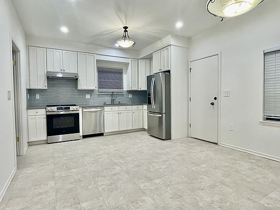 Remodeled Kitchen - stone countertop, backsplash, all new stainless steel appliances, sink and kitchen faucet ; dimmable recess lights, center lights; pre-wired internet/cable.