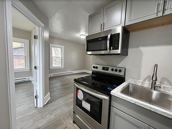 Kitchen, opening to living room on right, bedroom on left.