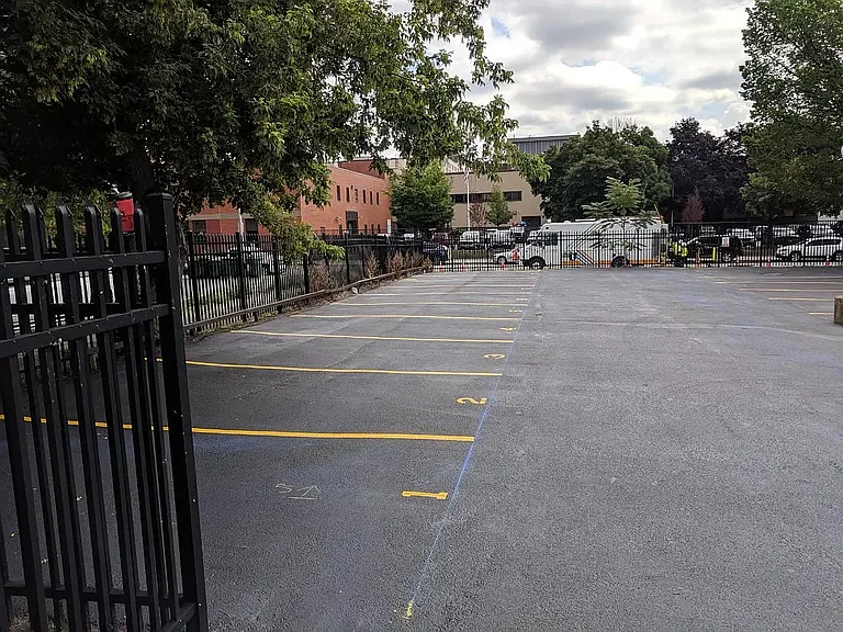 Gated parking lot with reserved spots