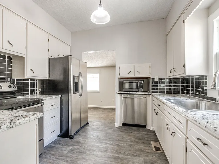 Kitchen with fridge and dishwasher