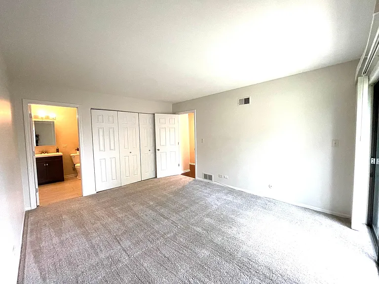 Master bedroom - full wall length closets and en suite bathroom