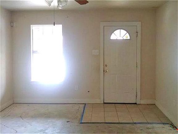 Enter the front door to a tiled entry, great for easy maintenance.