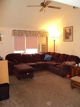 Living room with a vaulted ceiling.
