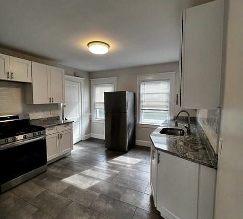Updated kitchen with stainless appliances and dishwasher