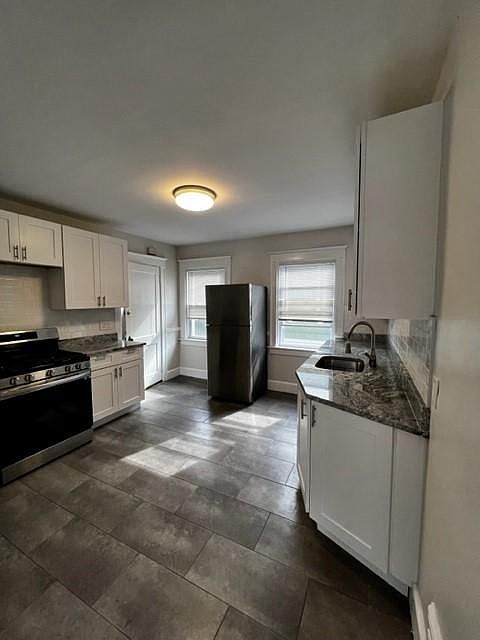 Updated kitchen with stainless appliances and dishwasher
