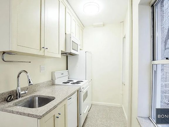 5th image of 520 E 11th St APT 10
