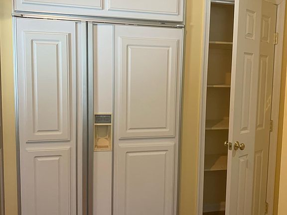 Refrigerator and one of two pantries