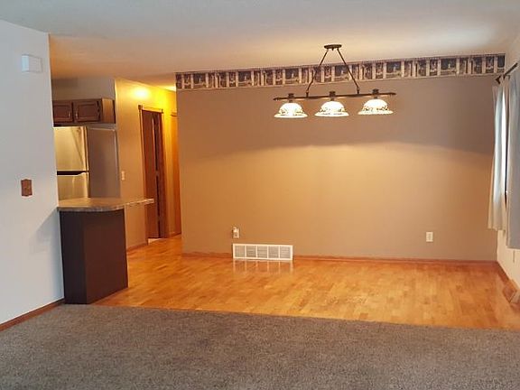 Dining room with hardwood floors.