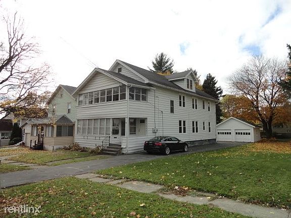House, garage, and side yard