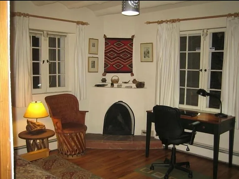 Second bedroom has a desk and file cabinet and the third fireplace.
