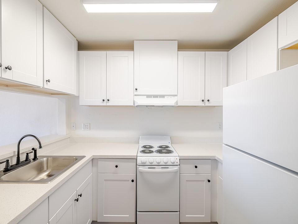 Bright kitchen with ample storage space.
