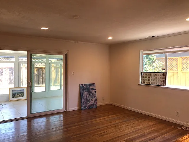 Bright living room with beautiful hardwood floors, fresh wall paint