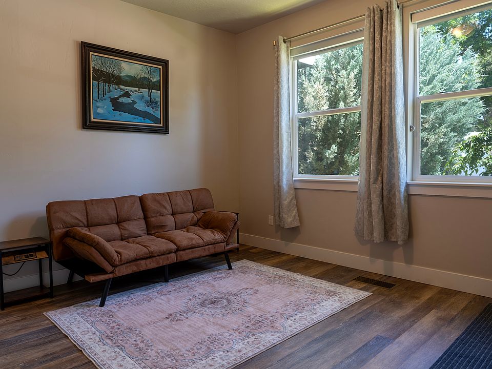 First floor bedroom, currently furnished as an office space with futon. Has a large closet.