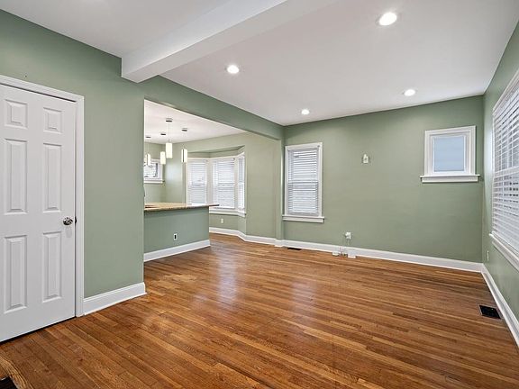 Living room featuring ample recessed lighting and coat closet