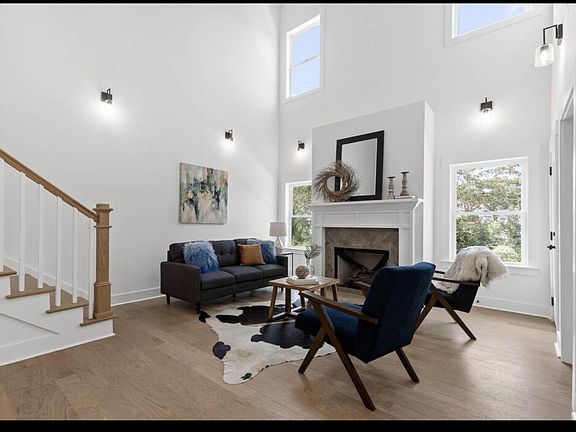 Double volume living room with fireplace