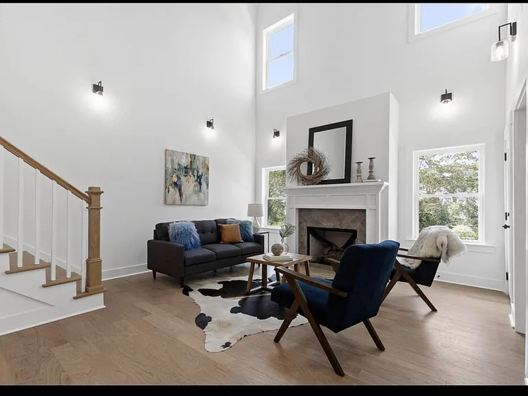 Double volume living room with fireplace