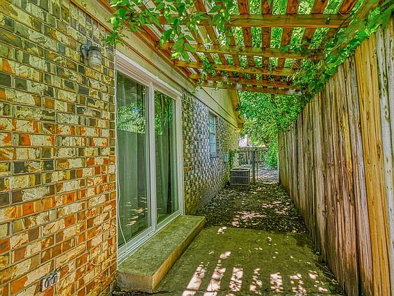 Pergola covering outside patio doors and entrance to backyard