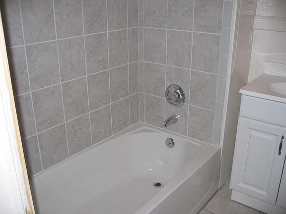 New bathtub with tile surround