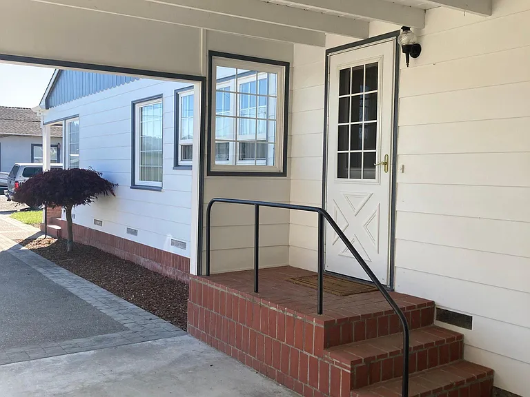 Carport opening to laundry and kitchen