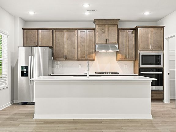 Kitchen in the Townsend floorplan at a Meritage Homes community in Zebulon, NC.