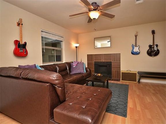 Your living room has great "feng-shui" for furniture placement that maximizes flow, with views of the fireplace & a large wide-screen (if desired).