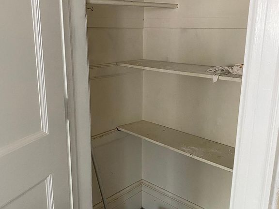 Deep pantry closet in kitchen.