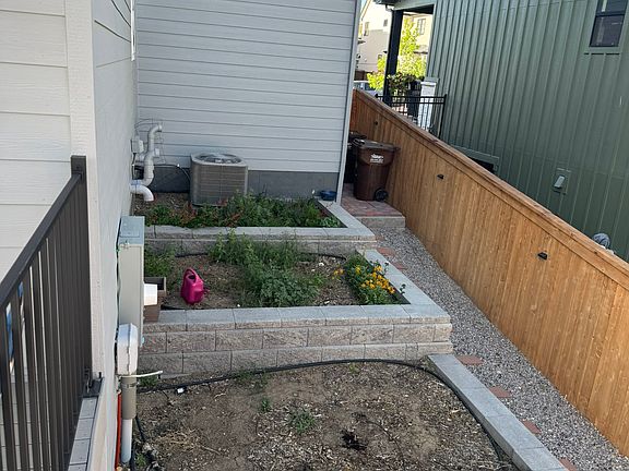 Exterior: Raised beds--bottom two for vegetables; top one for perennial flowers.