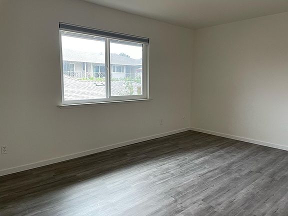 2nd bedroom with new grey spc wood flooring.