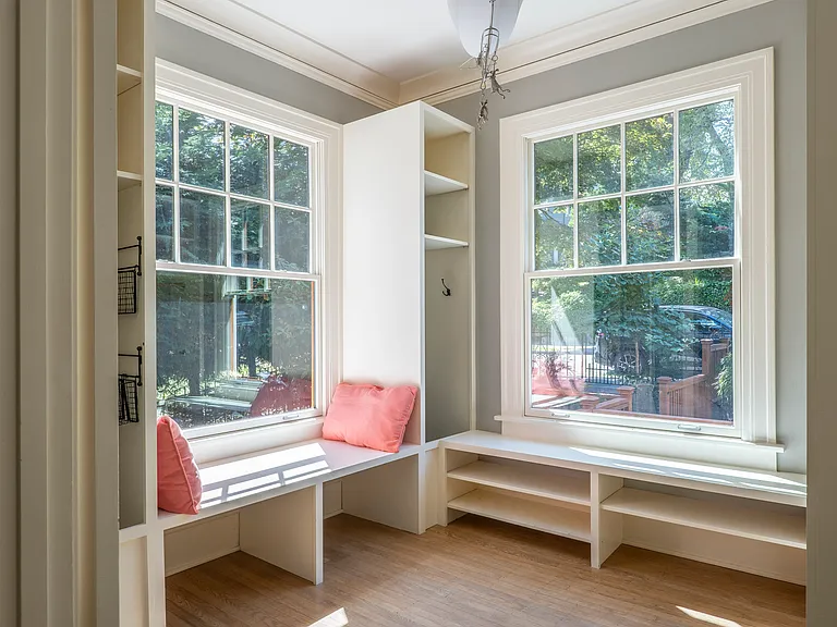 Mud room near front entryway. Most useful room in the house. 4 separate, large cubbies for each person plus benches.