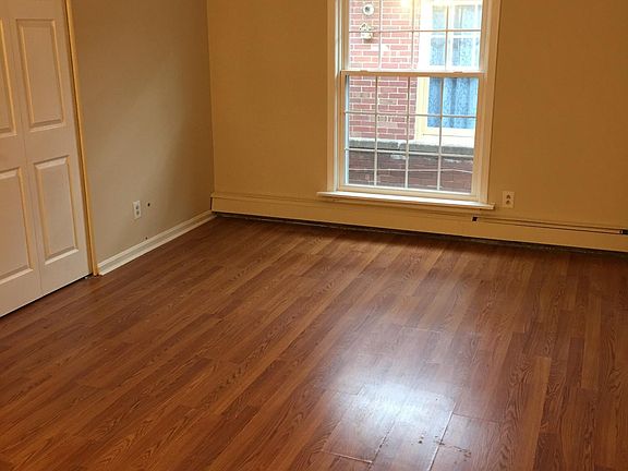 living room with hardwood and insulated modern windows