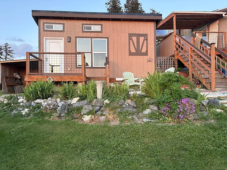 Studio on left, covered deck and house on right