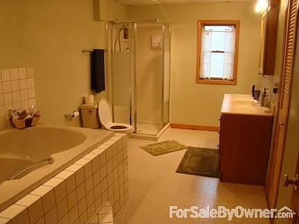 Lower level bathroom : Spacious basement bathroom with standup shower and big whirlpool tub.