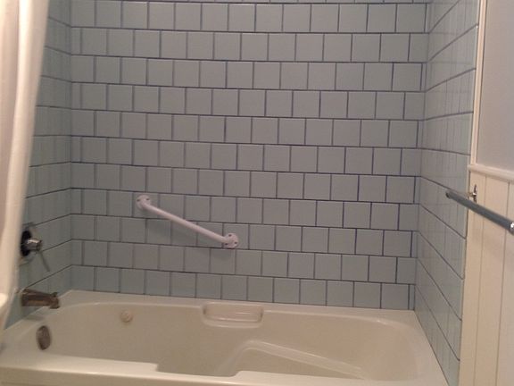 Jacuzzi tub in first bath