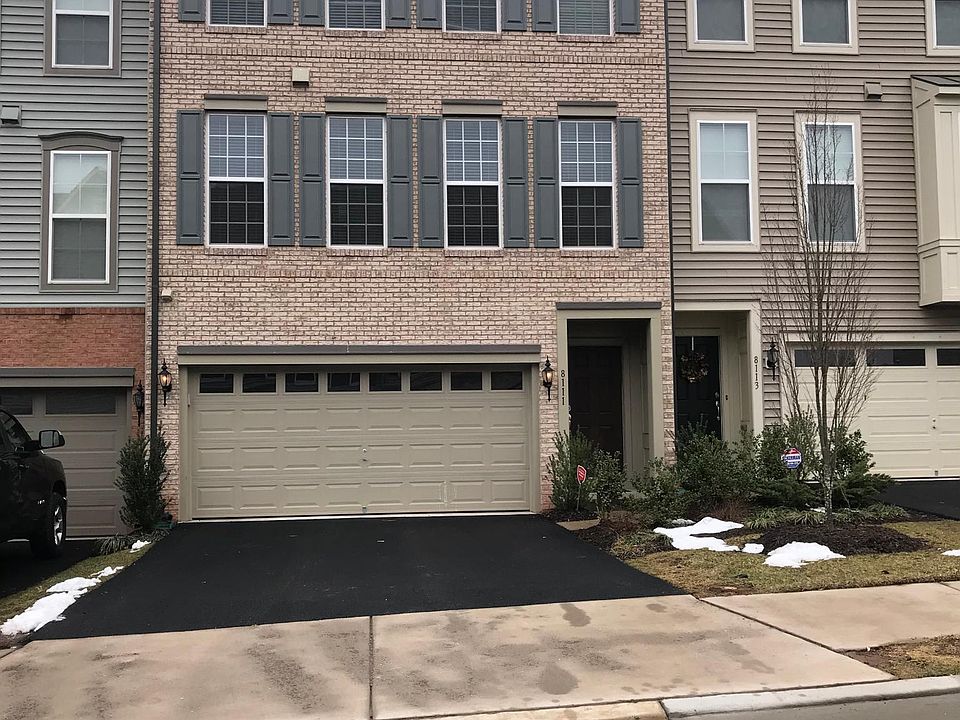 3 level brick with 2 car garage