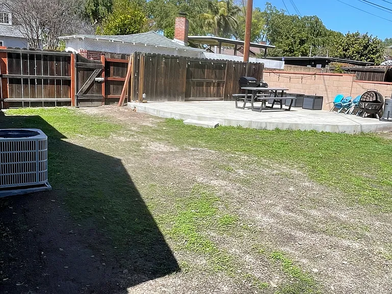 Large shared backyard with green space and room to relax outdoors.