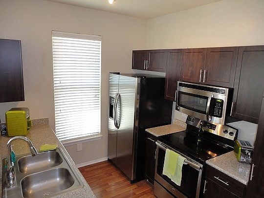 Kitchen with New Stainless Steel/Black Appliances