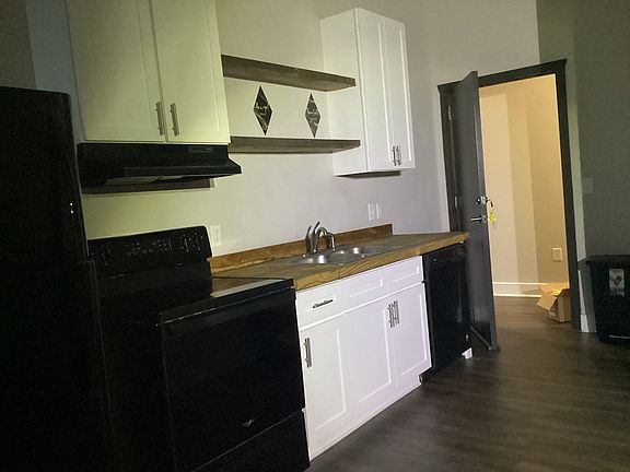 Kitchen with stove, refrigerator & dishwasher included.