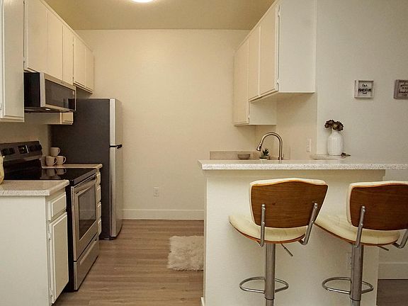 Spacious kitchens with new stainless steel appliances including dishwasher
